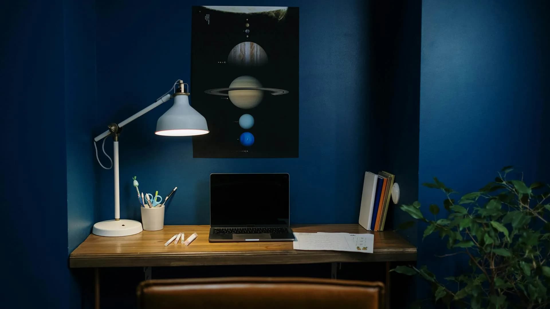 Laptop open on a desk in a quiet home office